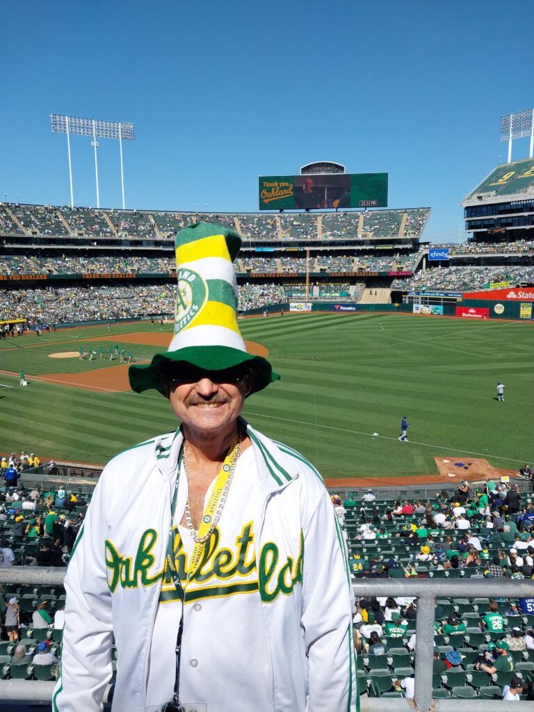 Oakland A's fan with hat — last game at Coliseum