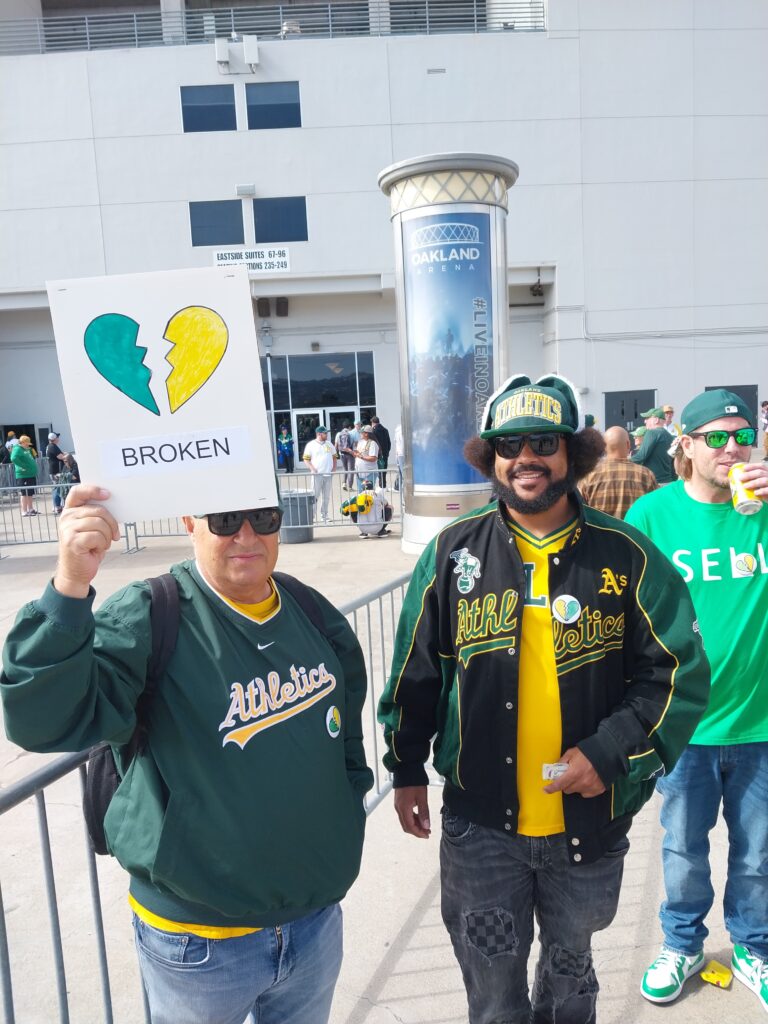  Oakland A's last game at Coliseum — fans with sign