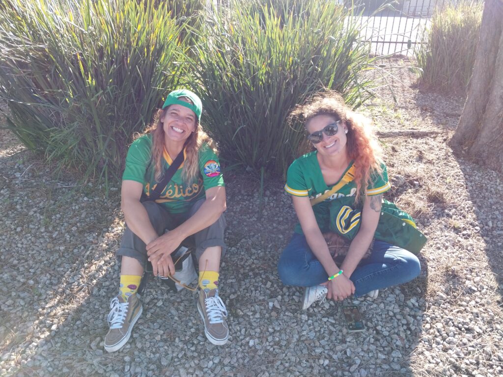 Two Oakland A's fan outside Coliseum after their last homestand in Oakland — 20240926_165032